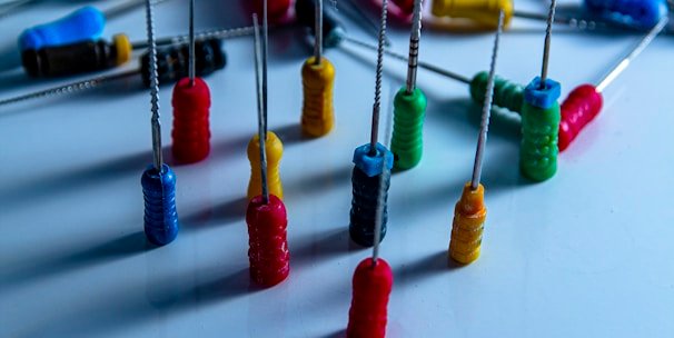 a bunch of pins and needles on a table
