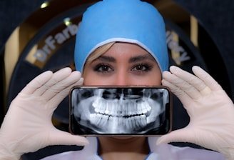 a woman holding a cell phone up to her face