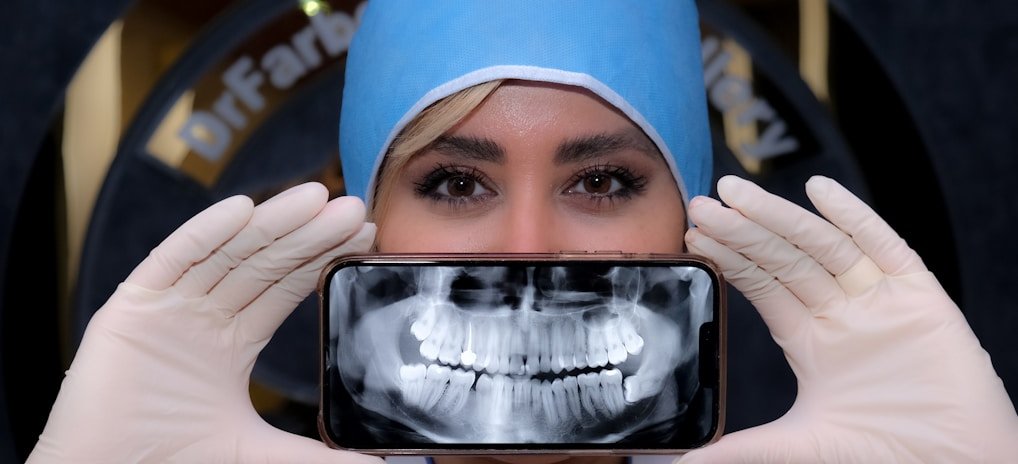 a woman holding a cell phone up to her face
